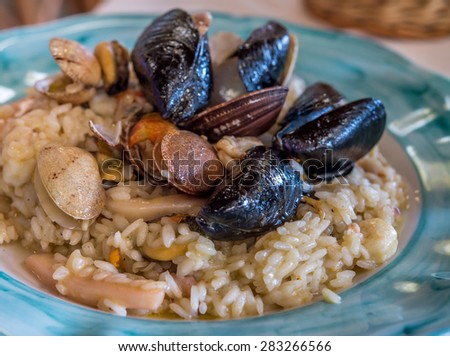 Risotto with sea food at Italian restaurant. Selective focus.