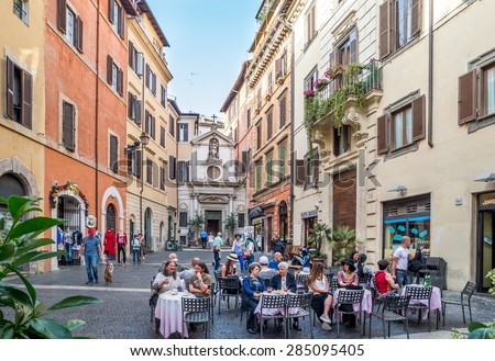 ROME, ITALY - MAY 05, 2015 : Unidentified people at street restaurant in Rome, Italy.