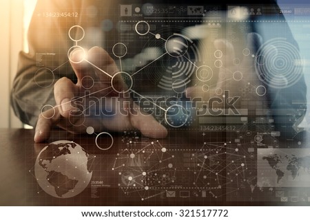 businessman hand working with modern technology and digital layer effect as business strategy concept