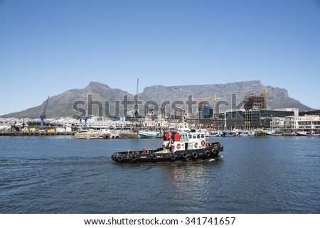 CAPE TOWN HARBOUR TUG UNDERWAY - OCTOBER 2015 - Ocean going tug Kestrel underway crossing the harbor and in view of Table Mountain Cape Town harbour South Africa