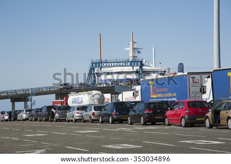 TRUCKS AND CARS WAIT TO LOAD ONTO A FERRY IN CHERBOURG NORTHERN FRANCE EU - CIRCA 2013 - Cars and lorries wait to load onto a cross channel ferry at Cherbourg France