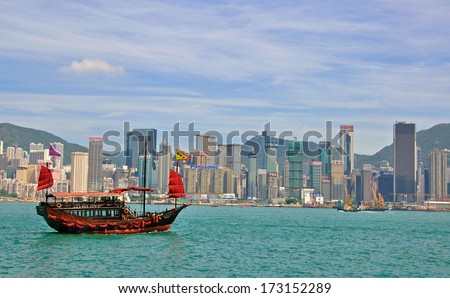 Hong Kong, China - June 5: Chinese Traditional Ship And Hong Kong Downtown From Kowloon Island On June 5, 2012. Hong Kong Is One Of The Two Special Administrative Regions Of China.