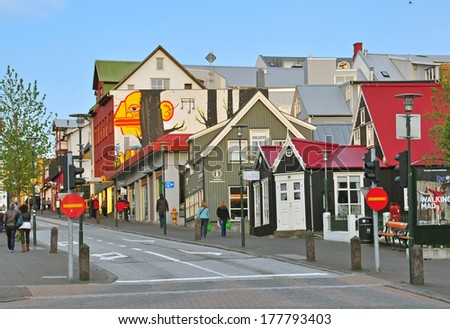 REYKJAVIK, ICELAND - JUNE 5: People goes down the street of Reykjavik downtown on June 5, 2013. Reykjavik is a capital and the largest city of Iceland.