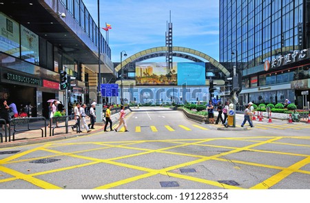 HONG KONG, CHINA - JUNE 5: People crossing the road in downtown on June 5, 2012. Hong Kong is a Special Administrative Region of the People\'s Republic of China.