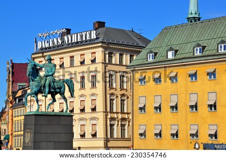 STOCKHOLM, SWEDEN - MARCH 16: View of colorful houses and monument on the square of Stockholm on March 16, 2013. Stockholm is the most populous city in Sweden and on the Scandinavian peninsula.