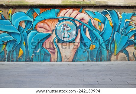 BARCELONA, SPAIN - DECEMBER 26: Street art by unidentified artist on the street  of Barcelona on December 26, 2014. Barcelona is the secord largest city of Spain.