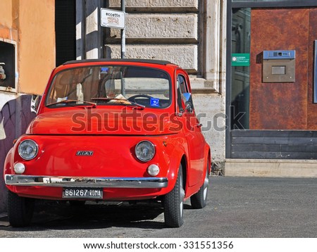 ROME, ITALY - OCTOBER 10: Retro car Fiat 500 parked in the street of Rome on October 10, 2011. Fiat 500 is a car produced by Fiat from 1957 till 1975.
