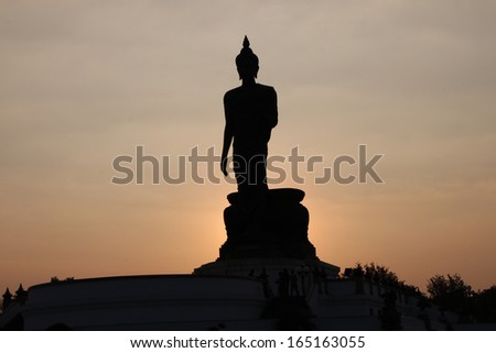 Big buddha statue silhouette when sun goes down at Buddhamonthon Park,Thailand