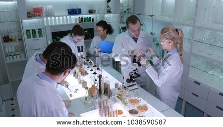 Team of Food Researchers Examination of Bio Plant Seedlings in Nursery Laboratory, Botanist Lab Scientists Doing Microscopic Biological Test on Organic Seed, Future Science Research Project Activity
