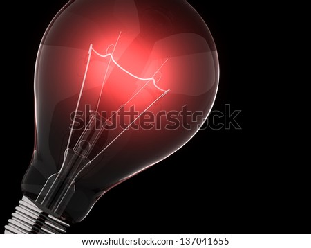 Red light bulb against black background