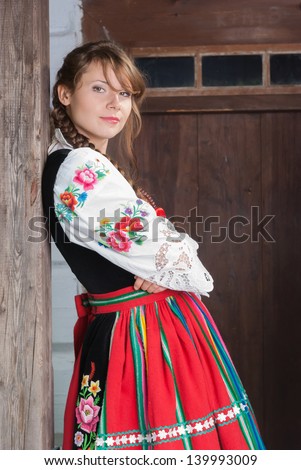 Young woman in traditional Polish costume or dress, a Polish folk costume.