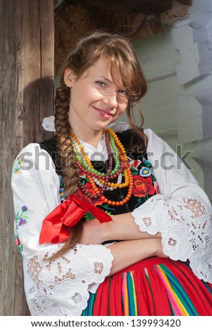 Young woman in traditional Polish costume, a Polish folk costume.