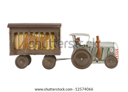 Old toy tractor on white background