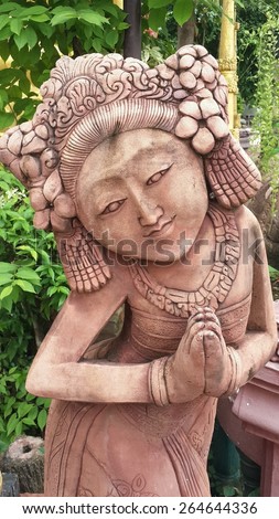 clay sculpture garden art Thailand stature cute gold monk face doll craft design  wall background