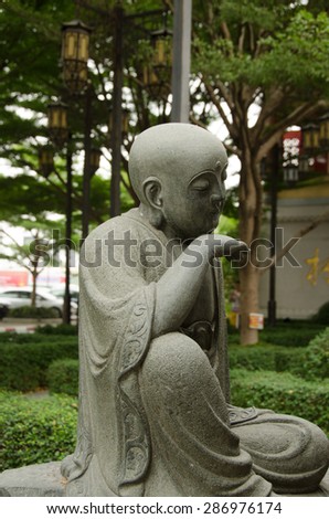 Chinese statue isolated wall background man culture Asia art garden old color