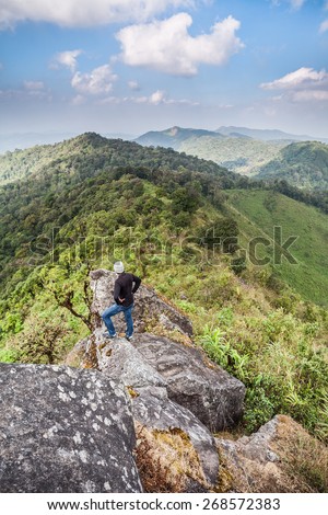 Chiangmai,Amphoe Aomgoi Thailand - December 14, 2013: Tourists stand on the cliff and sightseeing of mountain at the Doi Monjong Mt. in Aomgoi Wildlife Sanctuary