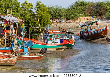 Phetchaburi,Thailand - April 29, 2012: Many fishing boats moored on the coast in Fishing Village  to prepare for fishing at night in Phetchaburi province,Thailand .