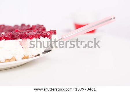 Ready for serving delicious handmade cheese cake slice with cake shovel and a cup of coffee on a white background