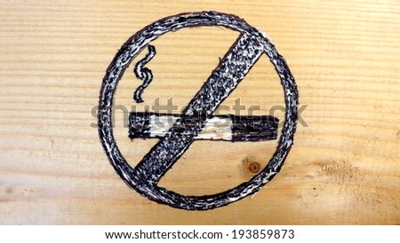 Quit Smoking Symbol Carved in Wood, Background Close-View