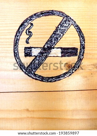Quit Smoking Symbol Carved in Wood, Background Close-View