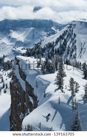 A skier finds a patch of power snow along side a cliff band at Grand Targhee Resort.