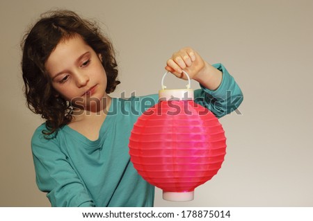 Girl holding Chinese lantern