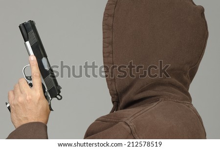 Bad guy in a hoodie with a gun