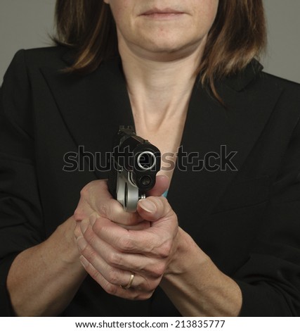 Woman Aims Gun in Self Defense