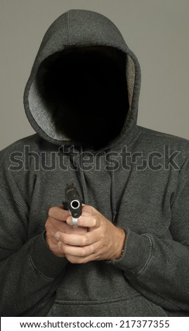 Blank face gangster with gun