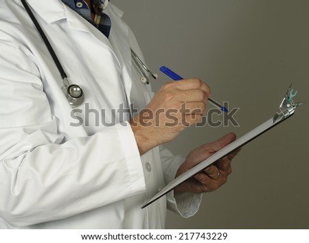 Doctor uses a clip board