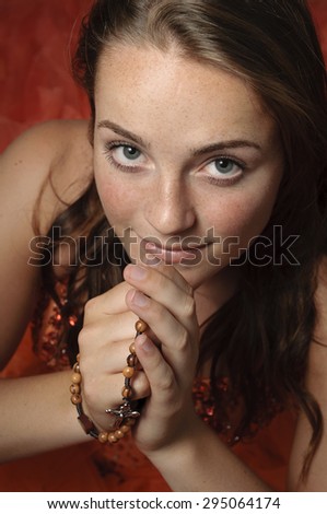 Woman prays the rosary