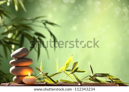 Spa still life with stacked of stone and bamboo leaf