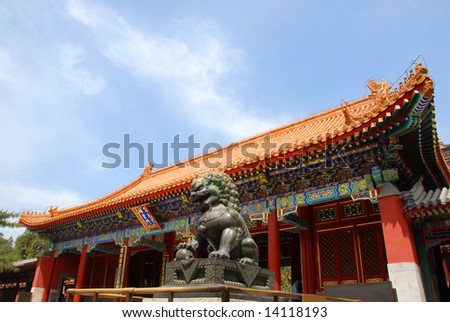 copper lion in front of an ancient architecture in summer palace of Beijing,China