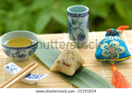 Chinese Glutinous Rice Dumpling(glutinous rice wrapped to form a pyramid using bamboo or reed leaves),People eat this food at Dragon Boat Festival(5th day of the 5th lunar month).