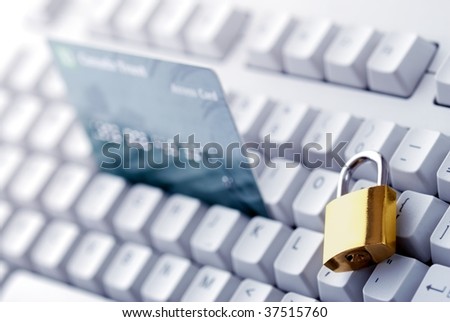 Credit card and lock on the keyboard.Financial security concept.