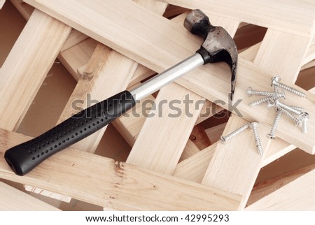 Hammer and nails on planks ,preparing for building works.