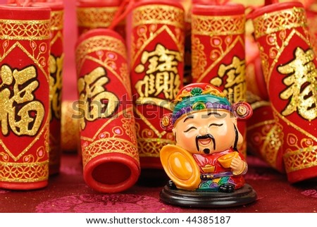 Chinese lunar new year decoration--Chinese traditional mammon figure and firecrackers.