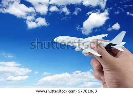 Hand holding model plane.
