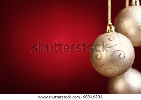 Gold christmas balls on red background