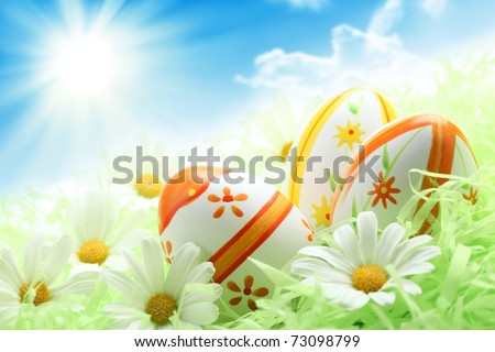 Colorful Easter Eggs and Daisy on Green Grass,Shallow Dof.