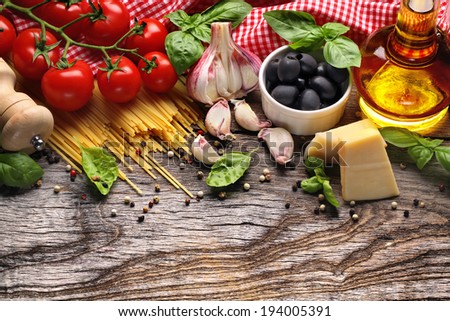 Italian food ingredients on wooden background