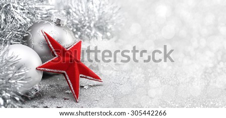 Red star and Christmas balls on abstract background