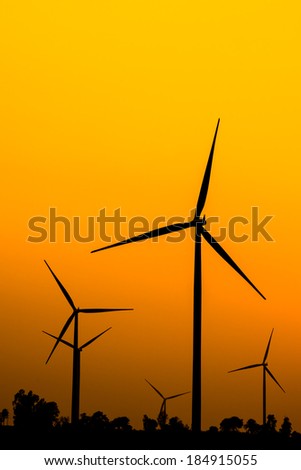 Silhouette wind turbine power with sunset and tree / wind farms Thailand,Nakhon Ratchasima