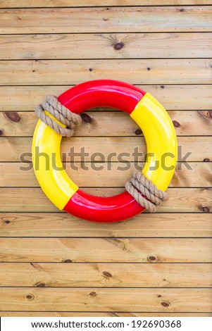 life belt on wooden wall