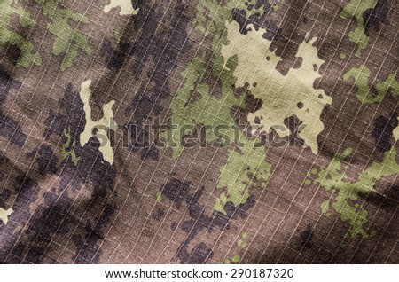 Wavy Military vegetato camouflage rip-stop fabric texture background