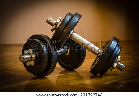 Black gym barbell, dumbbell with disks