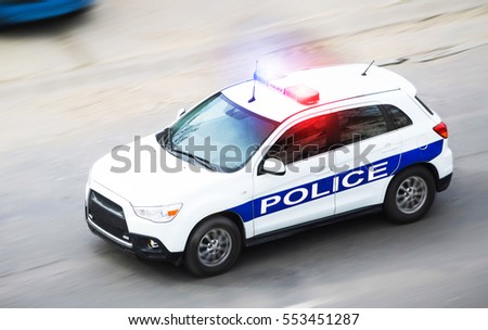 Police car in motion blur with flashing lights