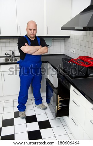 Technician repairs an electric stove