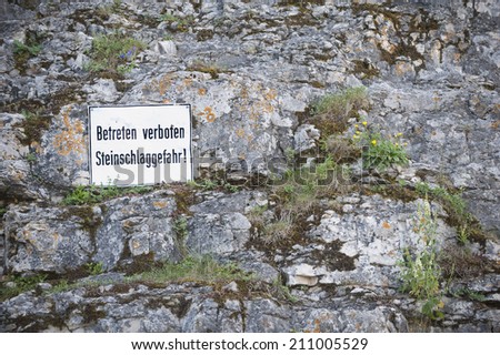 Sign rockfall hazard writen in German Language Steinschlaggefahr