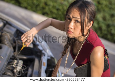 Businesswoman broken car on a working day. Portrait of Asia